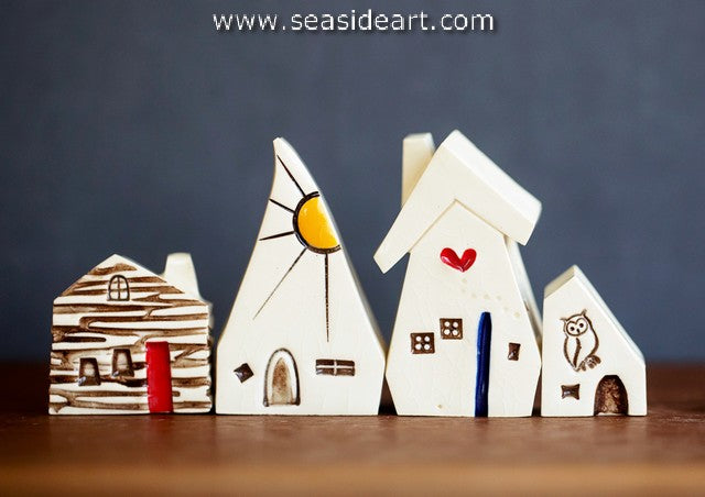 Village of Whimsy is a set of four separate ceramic sculptures by Katie Barnes