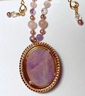 A Pink Quartz Pendant With Iris by Jewelry - Seaside Art Gallery