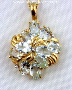 14kt yellow gold pendant with diamonds and aquamarines