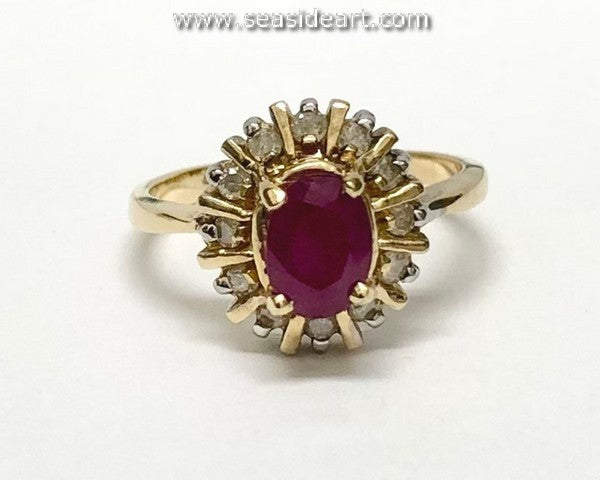 Ruby & Diamond halo style  ring in 14K yellow gold.