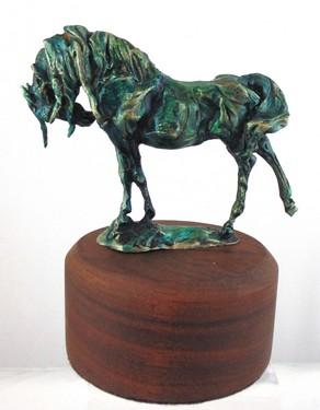 In the Stretch is a bronze sculpture of a horse by the artist, Cathy Kuzma