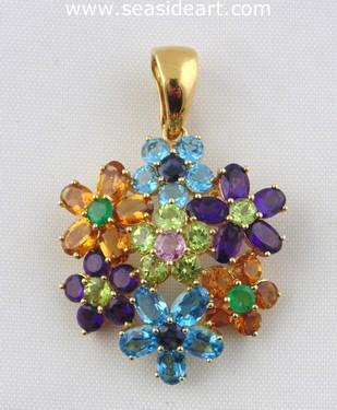 A Ladie's 18kt Yellow Gold Pendant with mutli gemstones.